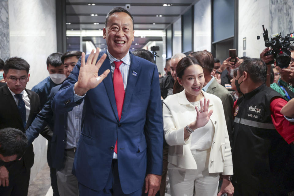 Pheu Thai political party's Srettha Thavisin, left, and Thaksin Shinawatra's daughter Paetongtarn react as they attend a press conference after Thailand's parliament voted in favor of his prime ministerial candidacy, at the party headquarters in Bangkok, Thailand, Tuesday, Aug. 22, 2023. (AP Photo/Wason Wanichakorn)