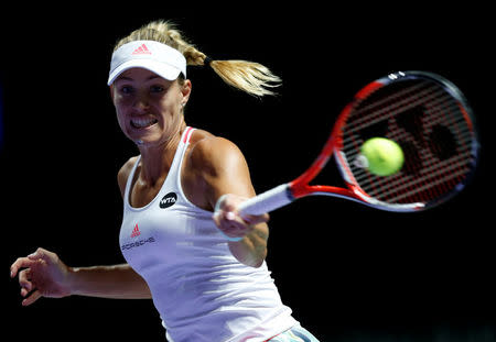 Tennis - Singapore WTA Finals Round Robin Singles - Singapore Indoor Stadium, Singapore - 25/10/2016 - Angelique Kerber of Germany in action against Simona Halep of Romania. REUTERS/Edgar Su