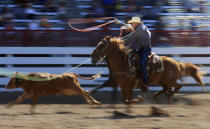 <p>Chuck Doebbler and Randal Eggemeyer compete during the Cheyenne Frontier Days Rodeo team roping slack event on Thursday, July 19, 2018, at Frontier Park. Blaine McCartney/Wyoming Tribune Eagle </p>