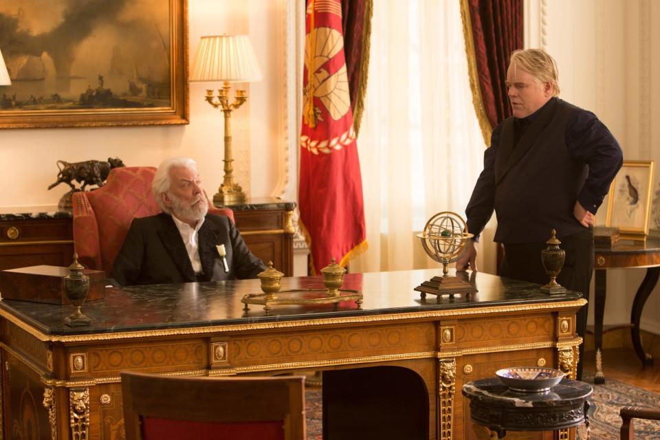 Donald Sutherland as President Snow and Philip Seymour Hoffman as Plutarch Heavensbee in a scene from "The Hunger Games: Catching Fire" filmed at Swan House.