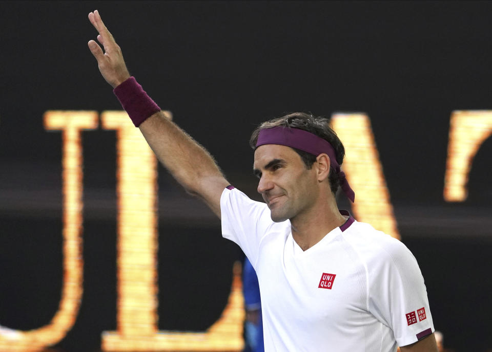 Switzerland's Roger Federer reacts after defeating Tennys Sandgren of the U.S. in their quarterfinal match at the Australian Open tennis championship in Melbourne, Australia, Tuesday, Jan. 28, 2020. (AP Photo/Lee Jin-man)