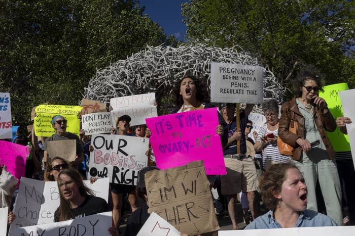 Abortion rights protesters chant slogans during a gathering to protest the Supreme Court's decision in the Dobbs v Jackson Women's Health case on June 24, 2022 in Jackson Hole, Wyoming.
