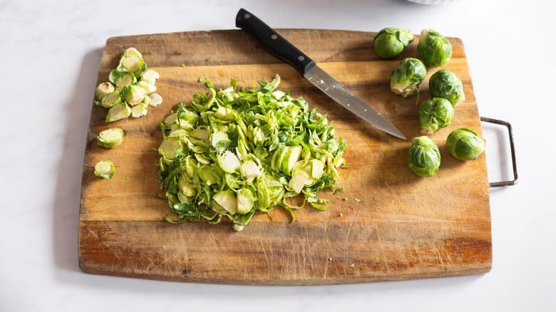 shaved brussels sprouts on cutting board 