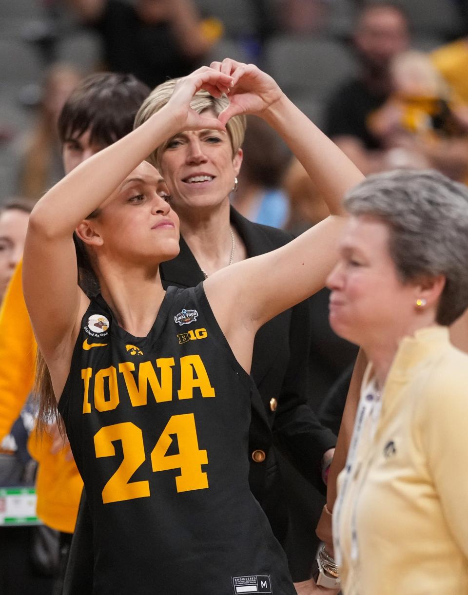 Iowa guard Gabbie Marshall (24) celebrates a win over South Carolina during the NCAA Women's Final Four semifinals basketball game in Dallas, Friday, March 31, 2023.