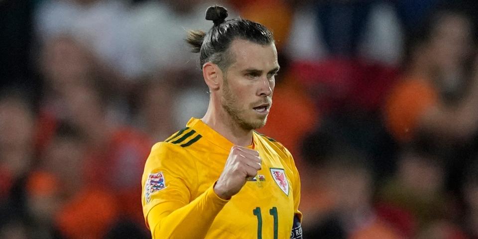 Gareth Bale pumps his fist during a Wales soccer match.