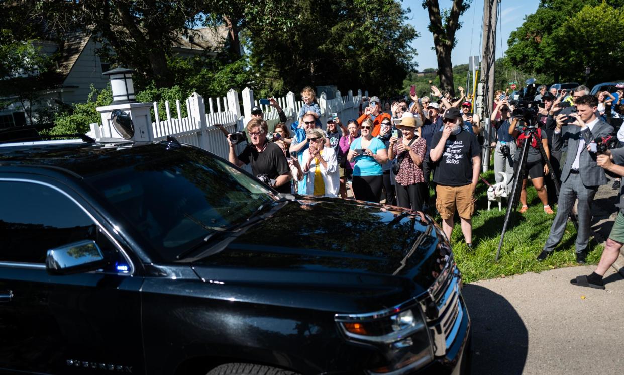 <span>People cheer as the Democratic vice-presidential nominee, Tim Walz, departs from his governor’s residence in St Paul on Tuesday.</span><span>Photograph: Stephen Maturen/Getty Images</span>