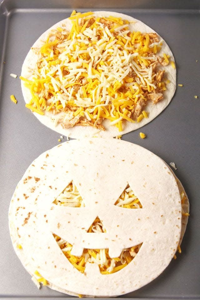 <p>It only takes 20 minutes to whip up this cute dinner idea for the kids.</p><p><em><strong>Get the recipe at <a href="https://www.delish.com/cooking/recipe-ideas/recipes/a55712/jack-o-lantern-quesadillas-recipe/" rel="nofollow noopener" target="_blank" data-ylk="slk:Delish;elm:context_link;itc:0;sec:content-canvas" class="link ">Delish</a>.</strong></em></p>