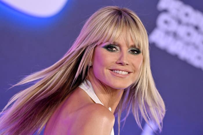 A closeup of Heidi smiling at a red carpet event