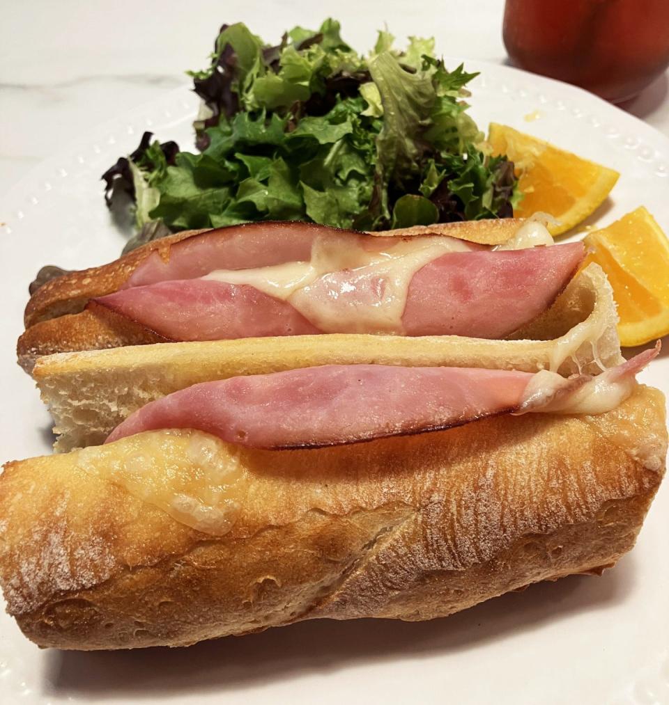 Le Parisien — ham and Baby Swiss cheese with salted butter on a fresh, toasted baguette — is among the popular sandwiches at Le Petit Paris.