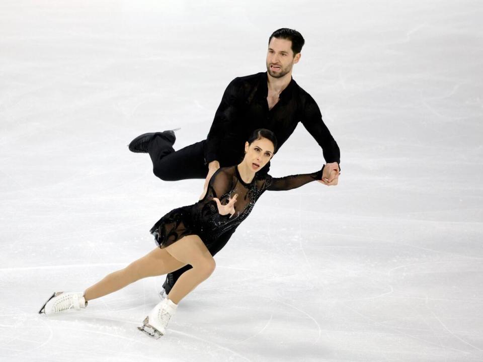 Canada's Deanna Stellato-Dudek and Maxime Deschamps compete during the pairs short program at the Grand Prix de France on Friday in Angers. The duo topped the standings with 64.33 points. (Sarah Meyssonnier/Reuters - image credit)