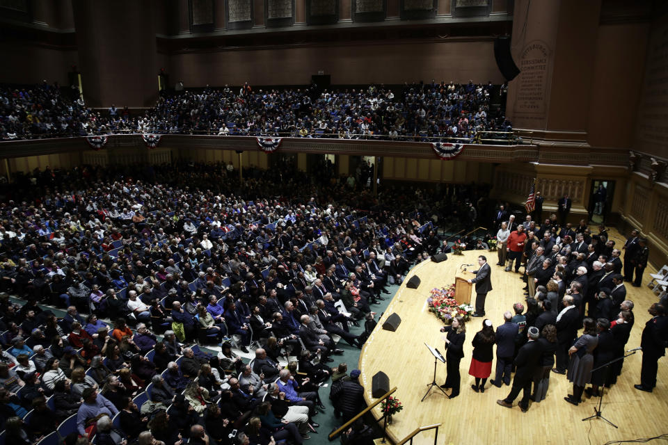 People attend a community gathering in Soldiers & Sailors Memorial Hall & Museum in the aftermath of the deadly shooting at the Tree of Life Synagogue in Pittsburgh, Sunday, Oct. 28, 2018. (AP Photo/Matt Rourke)