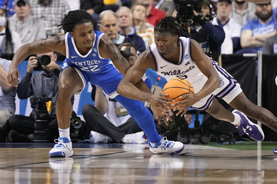 Kentucky guard Cason Wallace vies for the ball with Kansas State guard Cam Carter during the first half of a second-round college basketball game in the NCAA Tournament on Sunday, March 19, 2023, in Greensboro, N.C. (AP Photo/Chris Carlson)