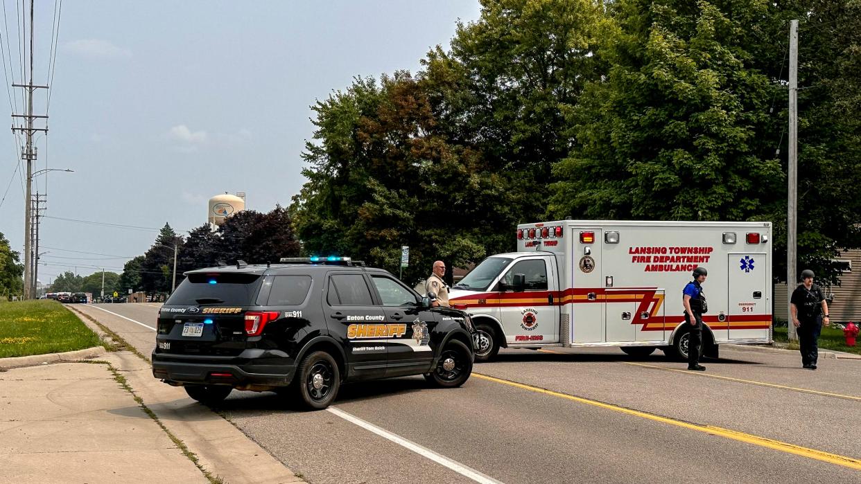 First responders block the road at the 3300 block of West Michigan Avenue while police investigate an incident on Tuesday, Aug. 1, 2023, in Lansing Township.