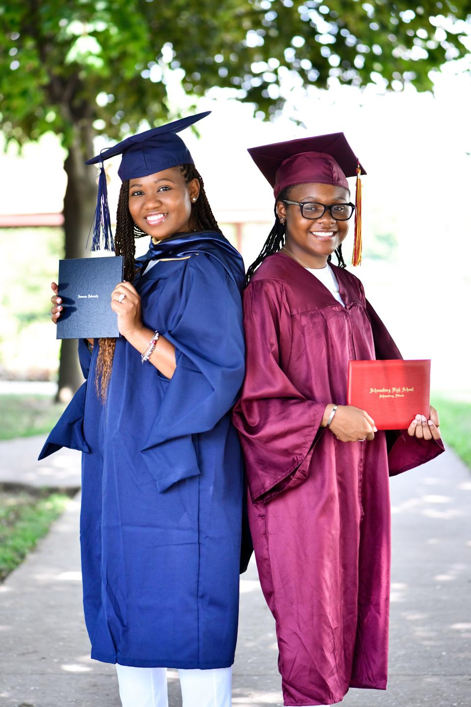 Mom Quiana Cohn and daughter India Cohn show off their diplomas while wearing their graduation caps and gowns. (Gaby Valladolid)