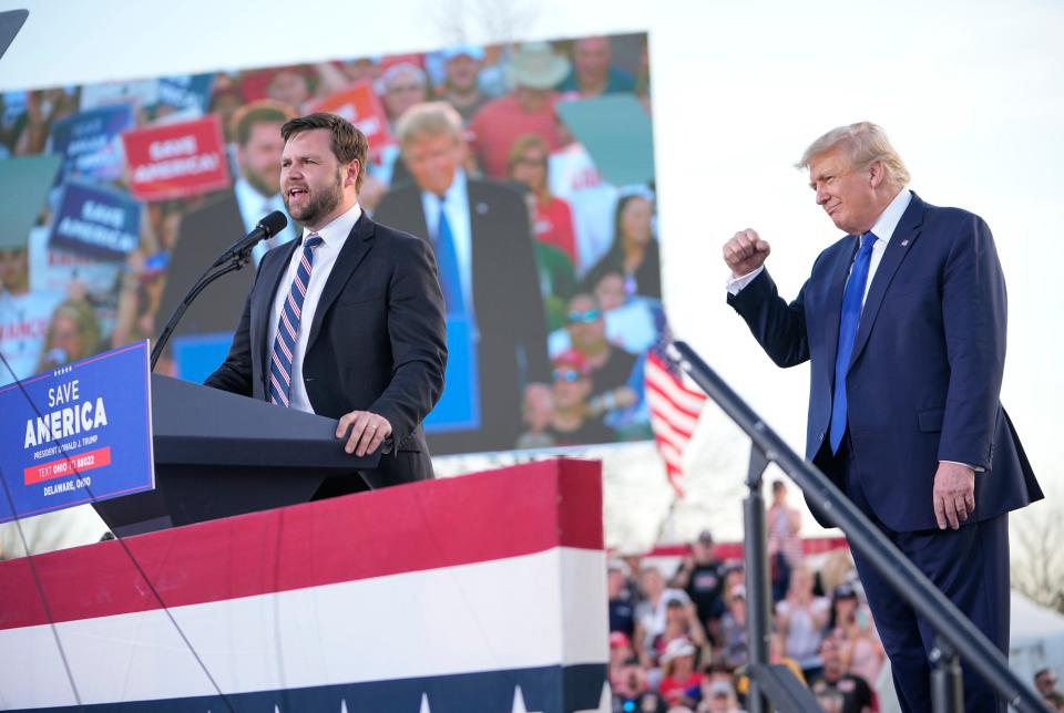 Apr 23, 2022; Delaware, Ohio, USA; JD Vance speaks on stage with former President Donald Trump during a rally at the Delaware County Fairgrounds. Mandatory Credit: Adam Cairns-The Columbus Dispatch