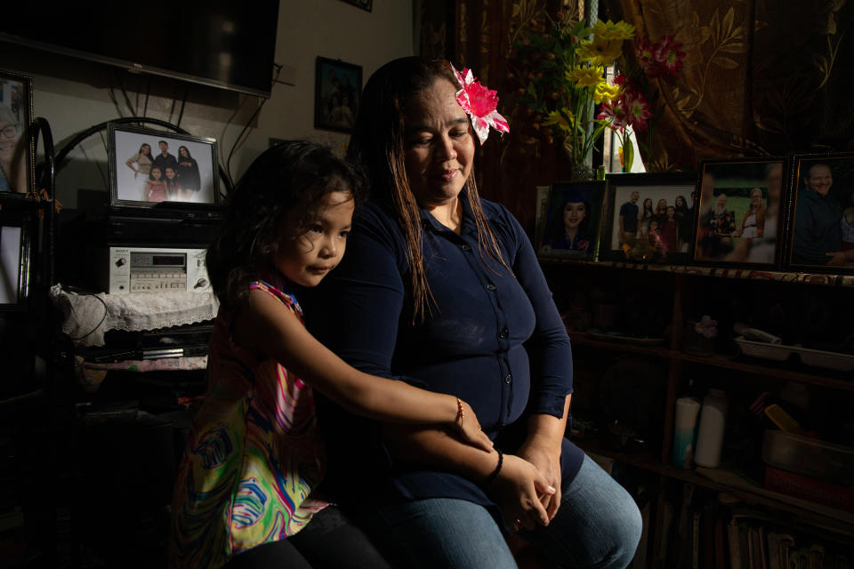 Michelleann Miller Pangilinan, an Amerasian who has struggled to become a U.S. citizen despite having the support of her American father and a DNA test to prove his paternity, photographed with her daughter Shania, at their home in Olongapo City on Feb. 19.<span class="copyright">Geric Cruz for TIME</span>