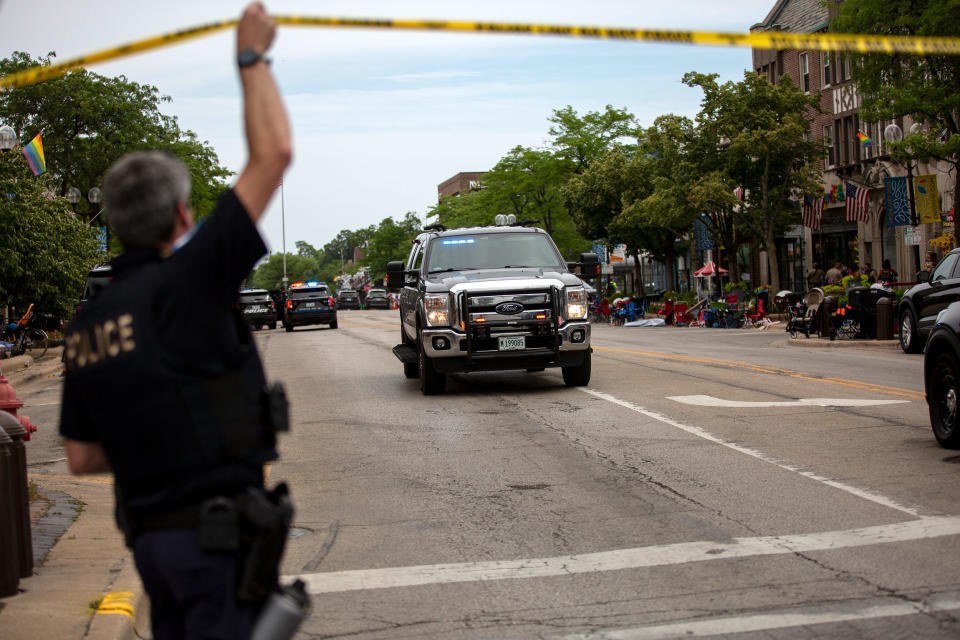 First responders work the scene of a shooting at a Fourth of July parade on July 4, 2022 in Highland Park, Illinois. Reports indicate at least five people were killed and 19 injured in the mass shooting. (Jim Vondruska / Getty Images)