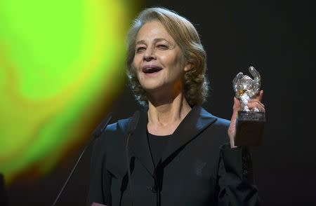 Actress Charlotte Rampling holds her Silver Bear for Best Actress for the film '45 Years' at the awards ceremony of the 65th Berlinale International Film Festival in Berlin February 14, 2015. REUTERS/Hannibal Hanschke