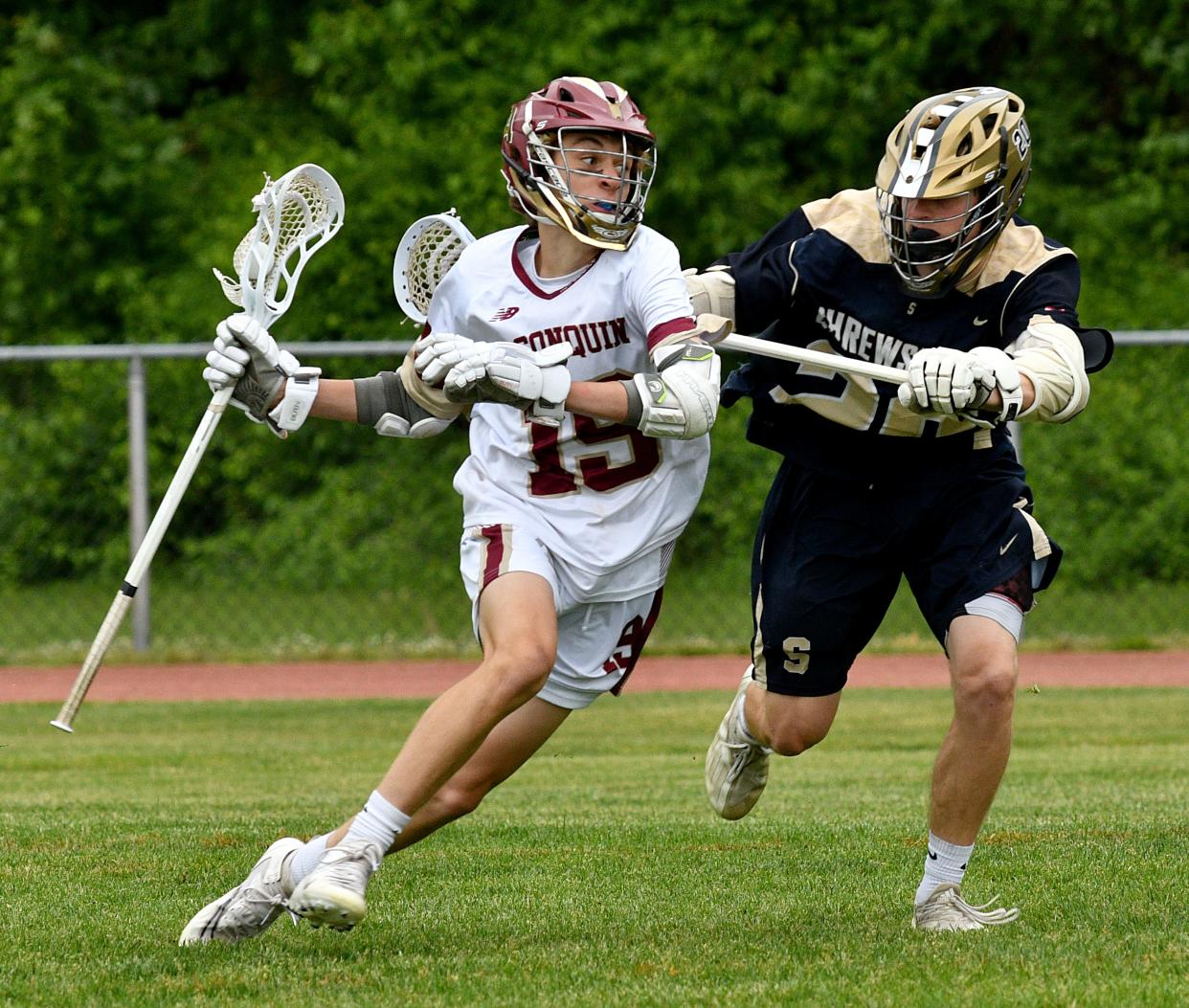 Algonquin's Benjamin Yosca tries to stay clear of Jake Mullholland during a CMADA Class A boys' lacrosse semifinal between Algonquin and Shrewsbury at Algonquin Regional.