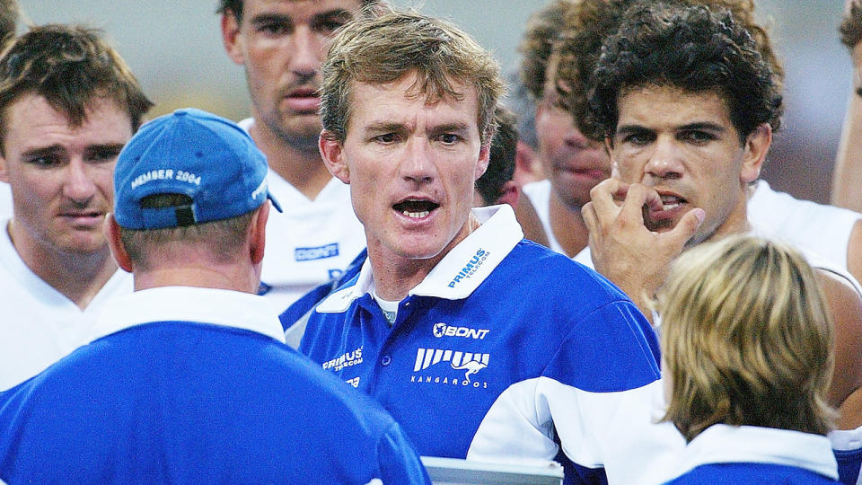 Dean Laidley, pictured here addressing his players during a North Melbourne match in 2005.