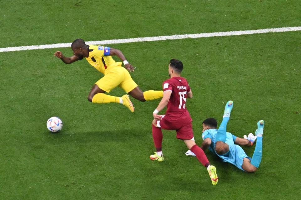 Saad Al Sheeb concedes a penalty on a difficult night for the Qatar goalkeeper (AFP via Getty Images)