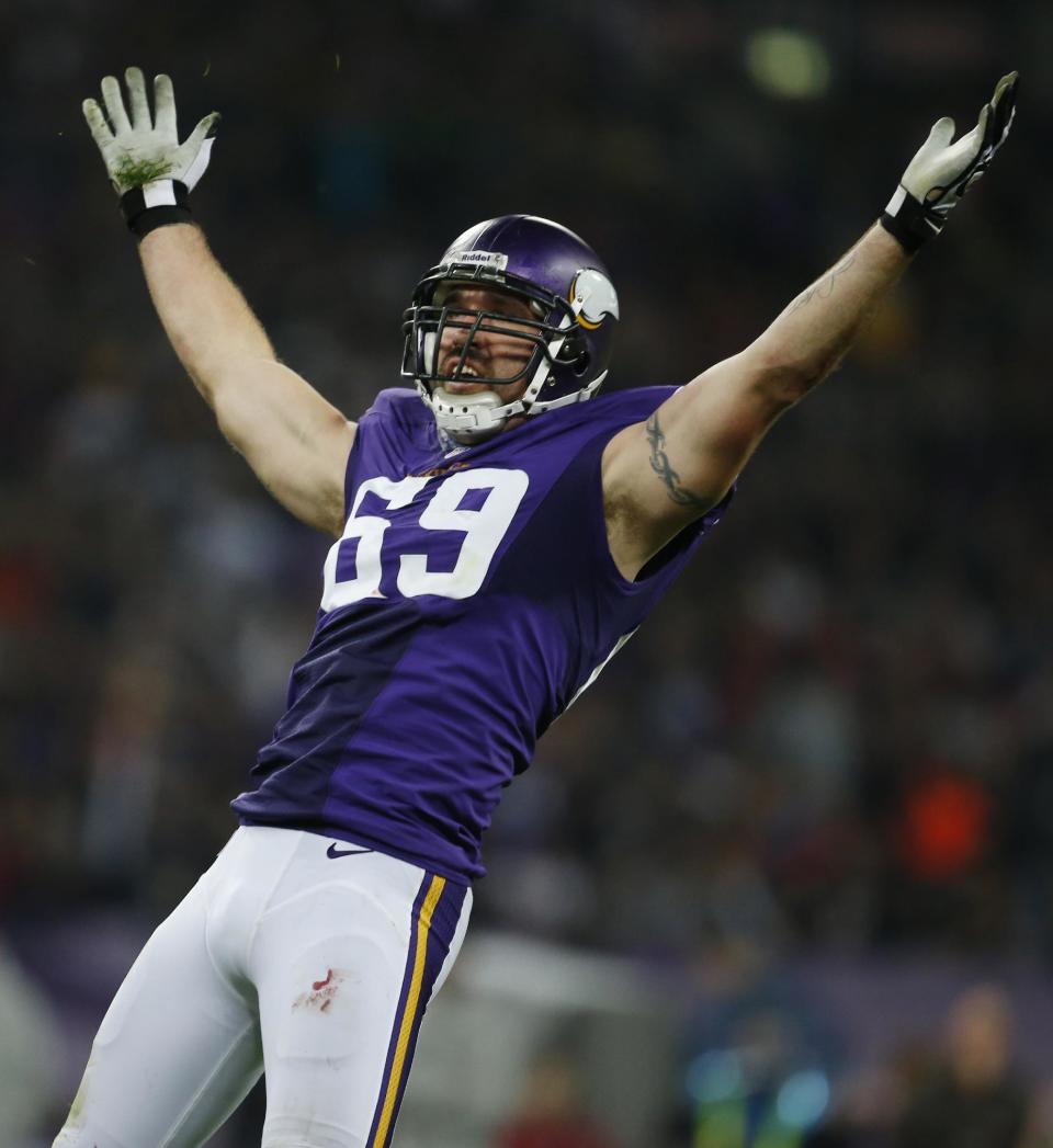 FILE - In this Sept. 29, 2013, file photo, Minnesota Vikings defensive end Jared Allen celebrates after sacking Pittsburgh Steelers quarterback Ben Roethlisberger during the first half of an NFL football game at Wembley Stadium in London. The Chicago Bears replaced one accomplished veteran pass rusher with another Wednesday, March 26, 2014, when they agreed to terms with Allen on a four-year contract. A person with knowledge of the agreement told The Associated Press that Allen will get $15.5 million guaranteed on a deal that could be worth as much as $32 million. The person requested anonymity because the terms have not been announced. (AP Photo/Matt Dunham, File)