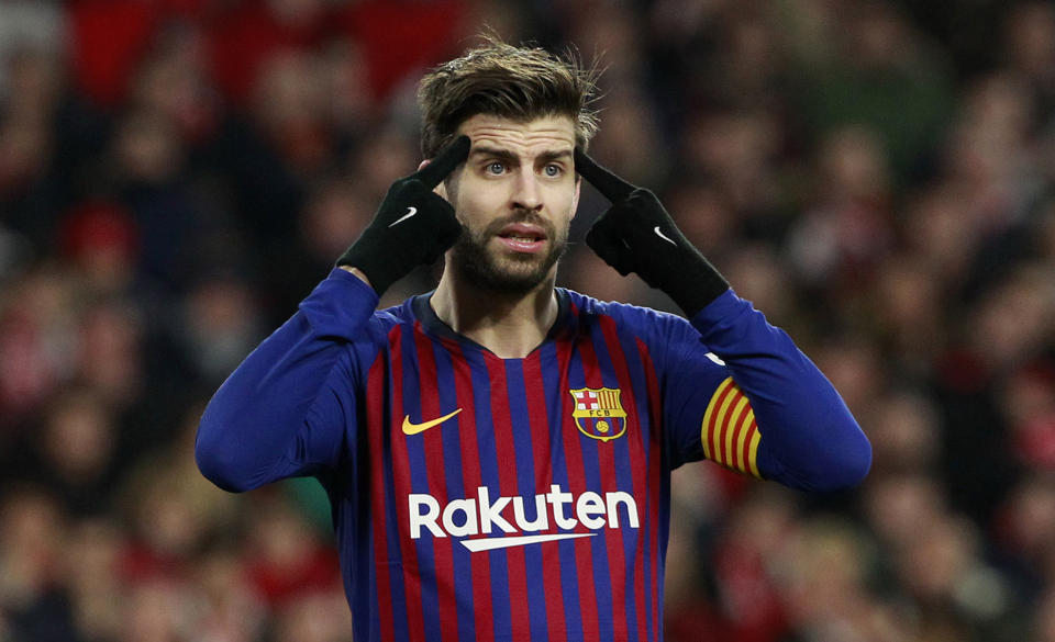 FC Barcelona's Gerard Pique gestures during a Spanish Copa del Rey soccer match between Sevilla and FC Barcelona at the Ramon Sanche Pizjuan stadium in Seville, Spain, Wednesday Jan. 23, 2019. (AP Photo/Miguel Morenatti)