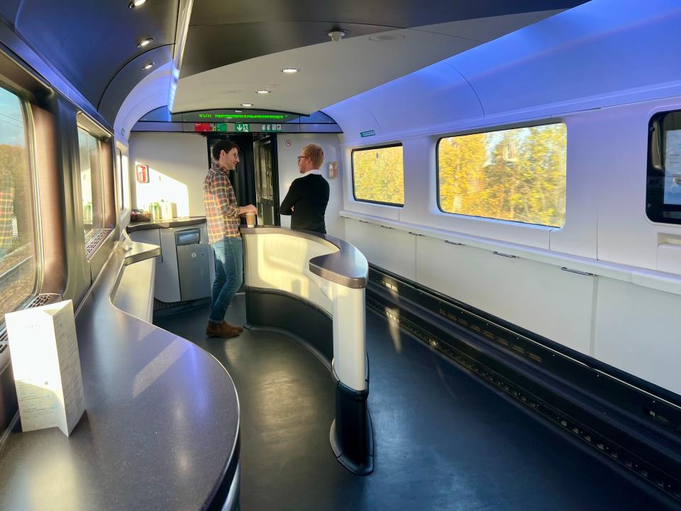 Passengers hanging out by the Cafe Metropole on the Eurostar.