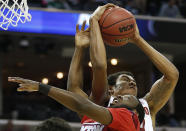 Dayton guard Khari Price (0) and Stanford forward Josh Huestis (24) vie for a loose ball during the first half in a regional semifinal game at the NCAA college basketball tournament, Thursday, March 27, 2014, in Memphis, Tenn. (AP Photo/John Bazemore)