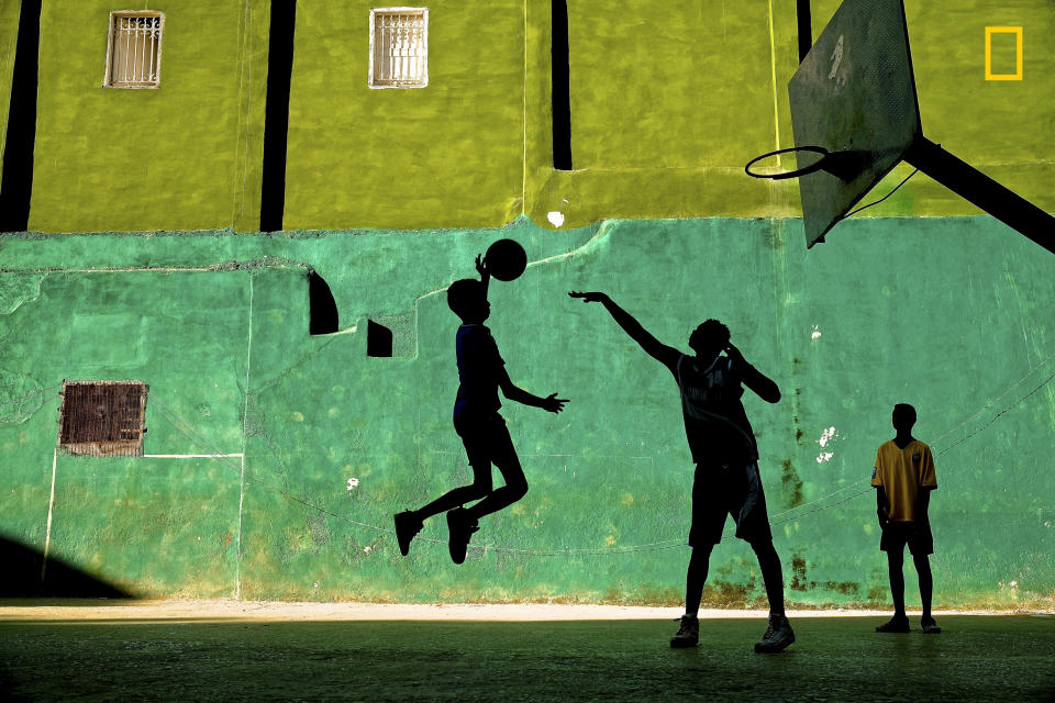 <p>Young boys play basketball after school in a Havana neighborhood, Cuba. (© Jeremy Lasky/National Geographic Travel Photographer of the Year Contest) </p>