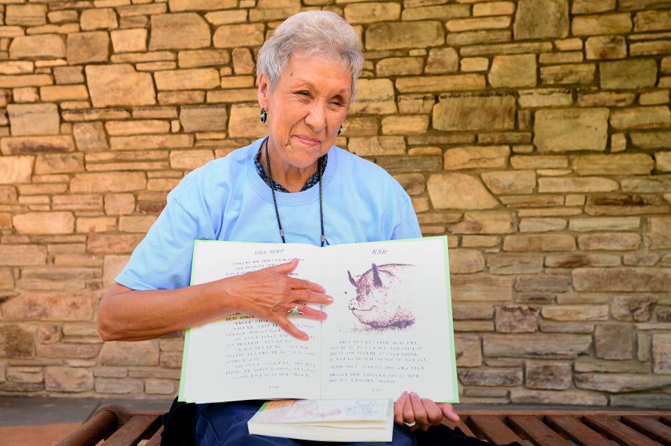 Myrtle Driver Johnson holds the version of E.B White's children's classic "Charlotte's Web" that she translated from English to the Cherokee syllabary and is used at Kituwah Academy, a language immersion school for preschool through fifth grade. Johnson grew up speaking Cherokee at home and English in school. 