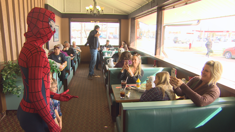 Superhero breakfast raises funds to get service dog for 11-year-old