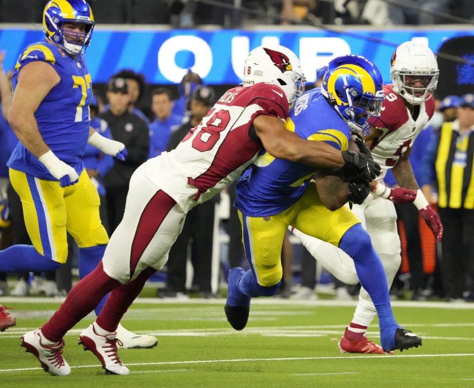 Jan 17, 2022; Los Angeles, California, USA;  Arizona Cardinals outside linebacker Jordan Hicks (58) tackles Los Angeles Rams running back Cam Akers (23) during the first quarter of the NFC Wild Card playoff game. Mandatory Credit: Michael Chow-Arizona Republic