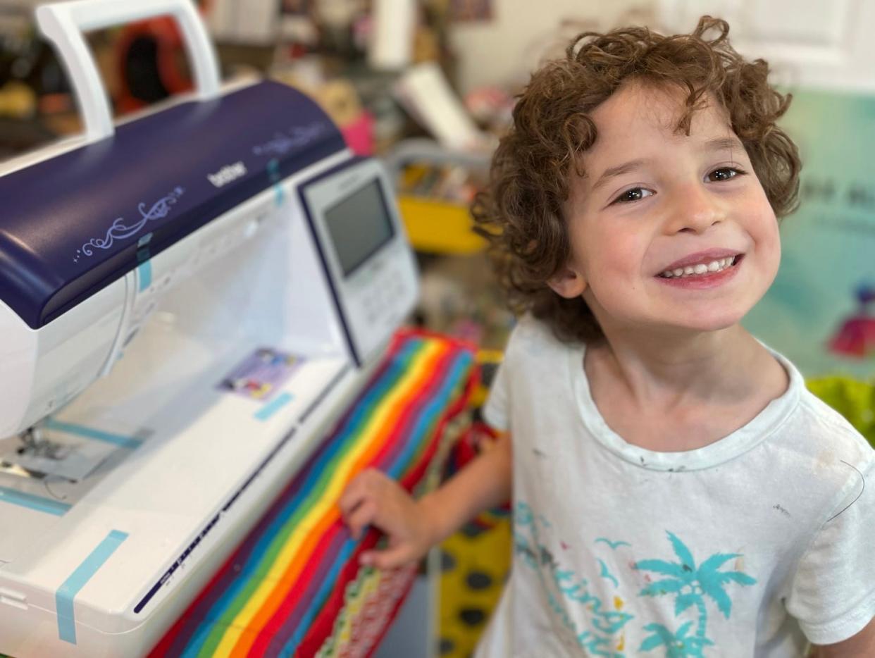 Max Alexander with his sewing machine