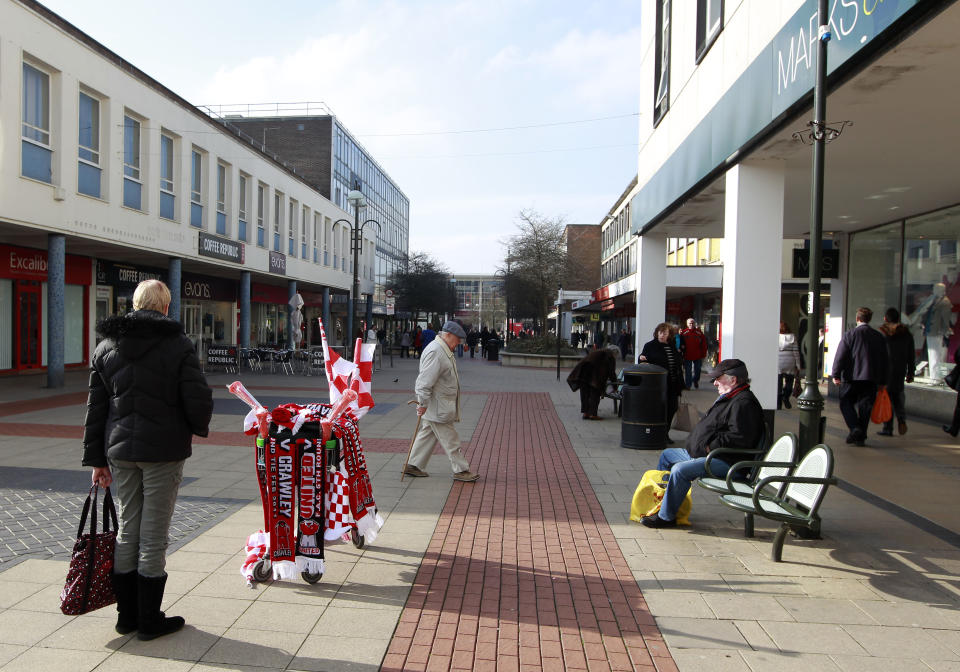 A trolley of Crawley Town Football Club souvenirs is seen in the centre of Crawley, south of England February 17, 2011. Crawley Town are due to play Manchester United in the fifth round of The FA Cup at Old Trafford next Saturday.  REUTERS/Eddie Keogh (BRITAIN - Tags: SPORT SOCCER)