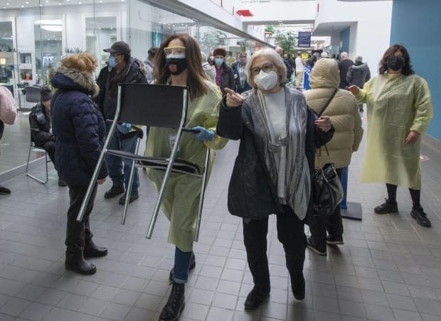 Officials say more chairs and staff will be deployed to mass vaccination sites.  (Ryan Remiorz/The Canadian Press - image credit)