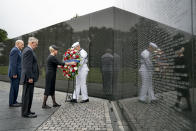 <p>Cindy McCain, wife of, Sen. John McCain, R-Ariz., accompanied by President Donald Trump’s Chief of Staff John Kelly, left, and Defense Secretary Jim Mattis, second from left, lays a wreath at the Vietnam Veterans Memorial in Washington, Saturday, Sept. 1, 2018, during a funeral procession to carry the casket of her husband from the U.S. Capitol to National Cathedral for a Memorial Service. McCain served as a Navy pilot during the Vietnam War and was a prisoner of war for more than five years. (Photo: Andrew Harnik, Pool/AP) </p>