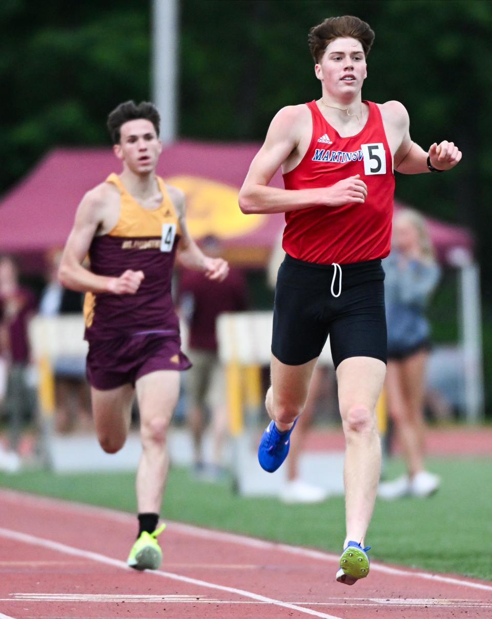 Martinsville’s Martin Barco finishes ahead of Bloomington North’s Caelan D'Onofrio to win the 1,600 meter run during the IHSAA boys’ track and field sectional championship at Bloomington North on Thursday, May 16, 2024.