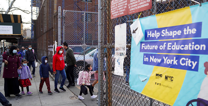 Children line up outside a school in New York City.