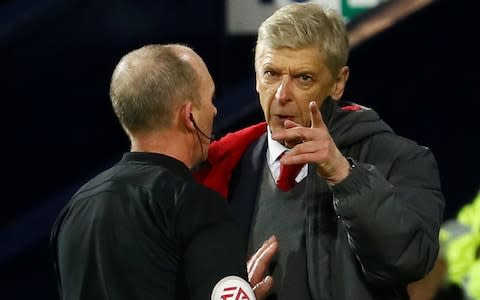 Arsene Wenger could face stadium ban after being accused of questioning Mike Dean's integrity