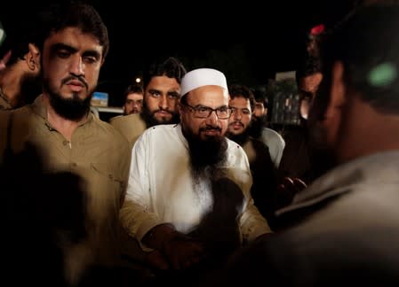 Hafiz Muhammad Saeed, chief of the Islamic charity organisation Jamaat-ud-Dawa (JuD), arrives to attend a campaign rally of political party, Milli Muslim League (MML), ahead of general elections in Islamabad,