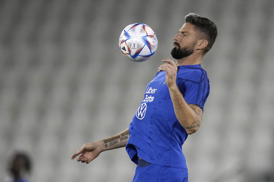 France's Olivier Giroud controls the ball during a training session at the Jassim Bin Hamad stadium in Doha, Qatar, Monday, Nov. 28, 2022. France will play in the World Cup against Tunisia on Nov. 30. (AP Photo/Christophe Ena)