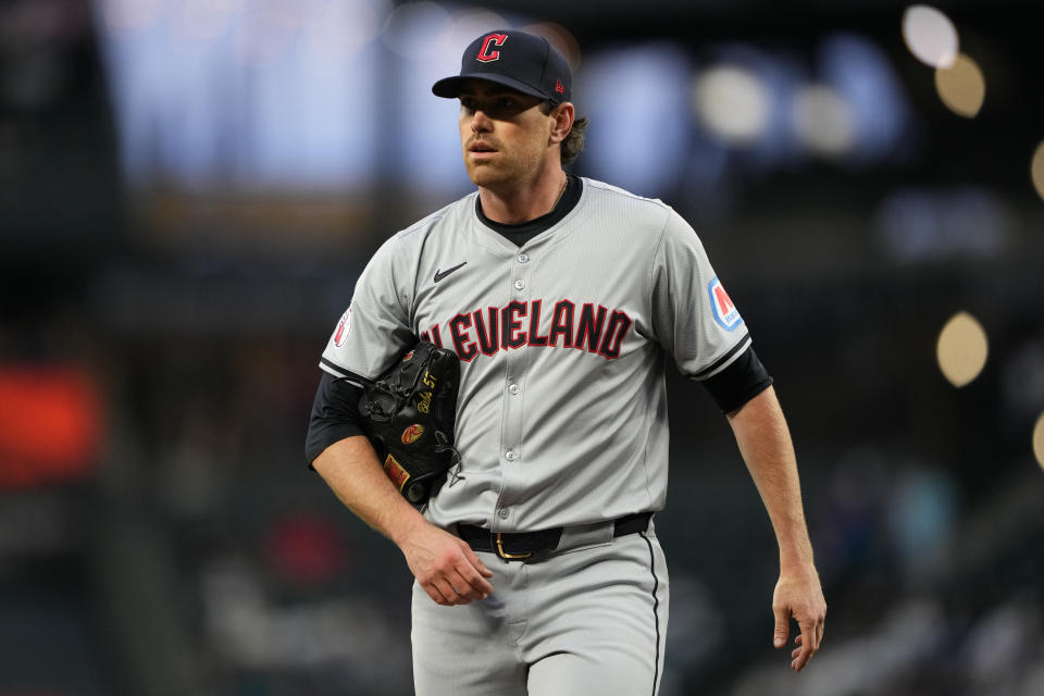 FILE - Cleveland Guardians starting pitcher Shane Bieber walks back to the dugout after throwing against the Seattle Mariners in a baseball game Tuesday, April 2, 2024, in Seattle. Cleveland's ace will have season-ending Tommy John elbow surgery, a major blow to the Guardians and the 2020 Cy Young winner, who had looked like his dominant self in two strong recent starts. (AP Photo/Lindsey Wasson, File)