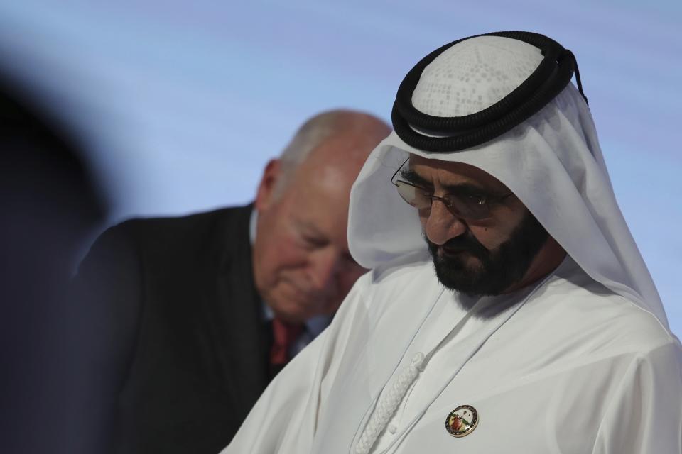 Sheikh Mohammed bin Rashid Al Maktoum, Dubai Ruler and UAE Prime Minister, right, leaves after the speech of Former U.S. Vice President Dick Cheney at the Arab Strategy Forum in Dubai, United Arab Emirates, Monday, Dec. 9, 2019. Dubai's ruler, Sheikh Mohammed bin Rashid Al Maktoum, attended the talk by Cheney, showing the respect still afforded to the 78-year-old former vice president. Cheney made a point himself to describe the UAE as "confident, forward-looking influence in the Middle East." (AP Photo/Kamran Jebreili)