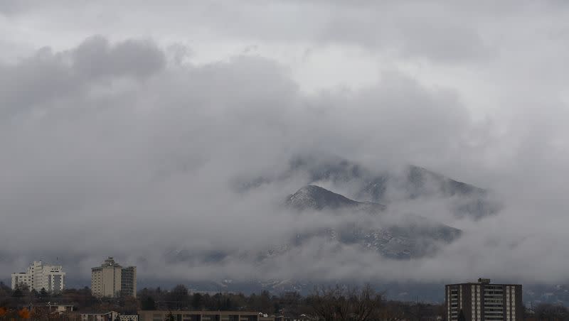 Clouds part to reveal the Wasatch Mountains in Salt Lake City on a rainy Wednesday, Jan. 10, 2018. Major thunderstorms have caused massive downpours, flooding and safety concerns across the state.