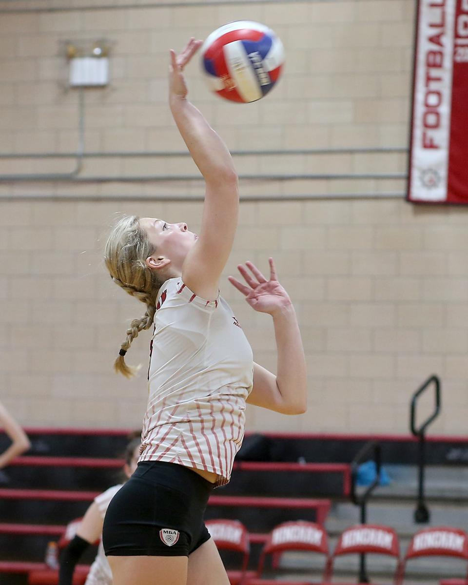 Hingham's Kate DiBartolomeo goes up for a spike during the first set of their match against Quincy at Hingham High on Wednesday, Sept. 21, 2022. Quincy would win 3-2.