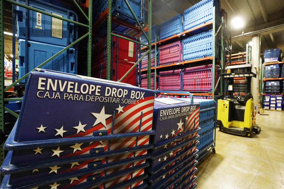 FILE - The warehouse at the Maricopa County Elections Department stores all the equipment and signage for all the voting precincts in Phoenix, Sept. 8, 2022. A new poll says Americans from across the political spectrum say misinformation increases extreme political beliefs and hate crimes. The survey from The Pearson Institute and The Associated Press-NORC Center for Public Affairs Research finds that about three-quarters of adult Americans believe misinformation is leading to more extreme political views as well as violence based on race, gender or religion. (AP Photo/Ross D. Franklin, File)