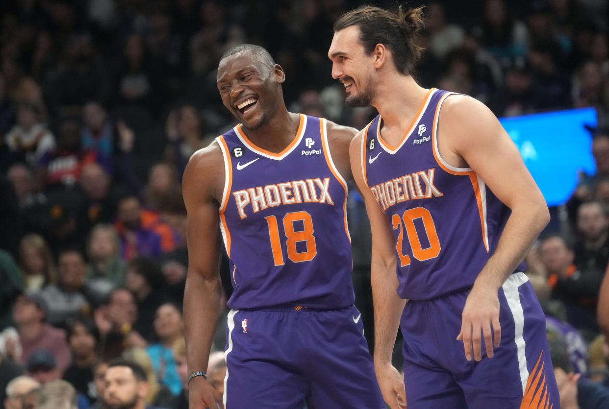 Jan 22, 2023; Phoenix, Arizona, USA; Phoenix Suns center 	Bismack Biyombo (18) congratulates forward Dario Saric (20) after he made a shot while being fouled against the  Memphis Grizzlies at Footprint Center. Mandatory Credit: Joe Rondone-Arizona Republic