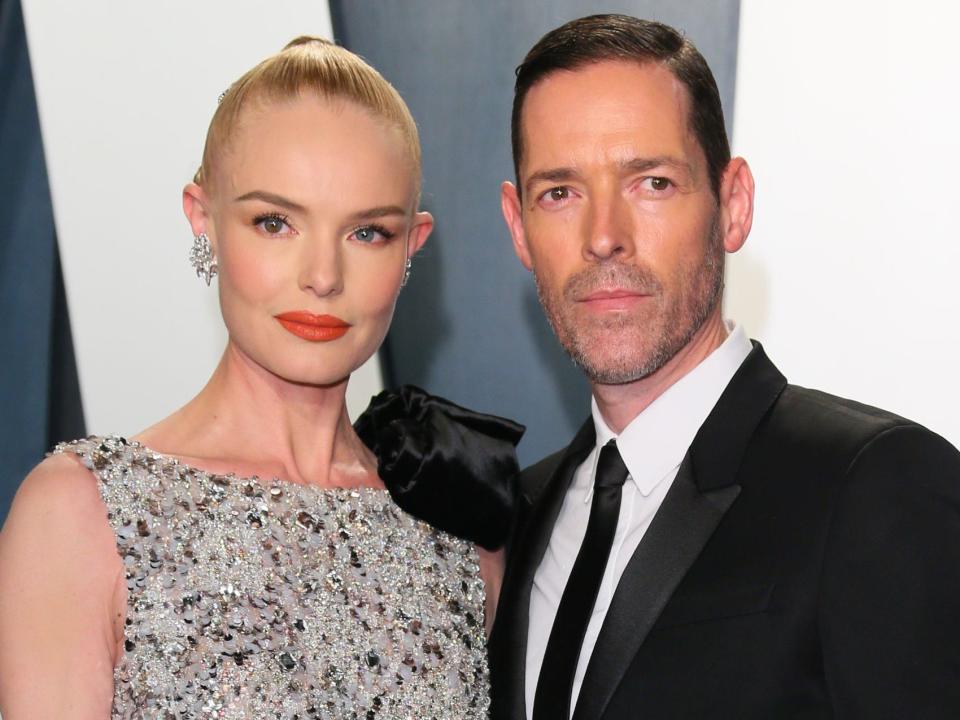 Kate Bosworth and Michael Polish posing at the 2020 Vanity Fair Oscar Party.