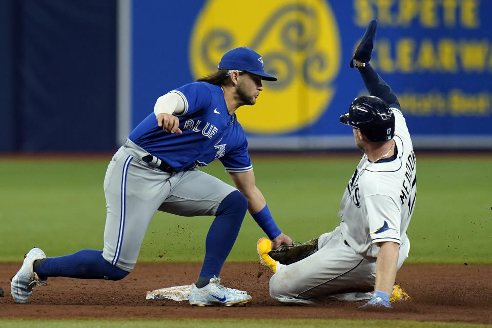 Toronto Blue Jays shortstop Bo Bichette tags out Tampa Bay Rays' Austin Meadows (17) attempting to steal second during the third inning of a baseball game Tuesday, Sept. 21, 2021, in St. Petersburg, Fla. (AP Photo/Chris O'Meara)